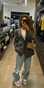 fashion outfit, grey oversized blazer, baggy jeans, beige bag.